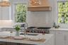 Professional grade appliances and refined finishes elevate the kitchen into a true culinary centerpiece designed for both function and style