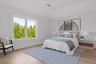 Generously sized guest bedroom with refined finishes throughout