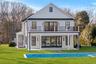 Back of property with a patio, gunite pool and a balcony