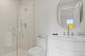 Refined spa like full bathroom with high caliber finishings