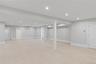 A full,expansive basement offering endless possibilities for recreation fitness, media or additional living space, includes a bedroom and bathroom.