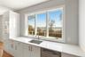 View out the kitchen window with custom cabinetry