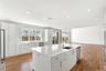 Large center island with sink and dishwasher
