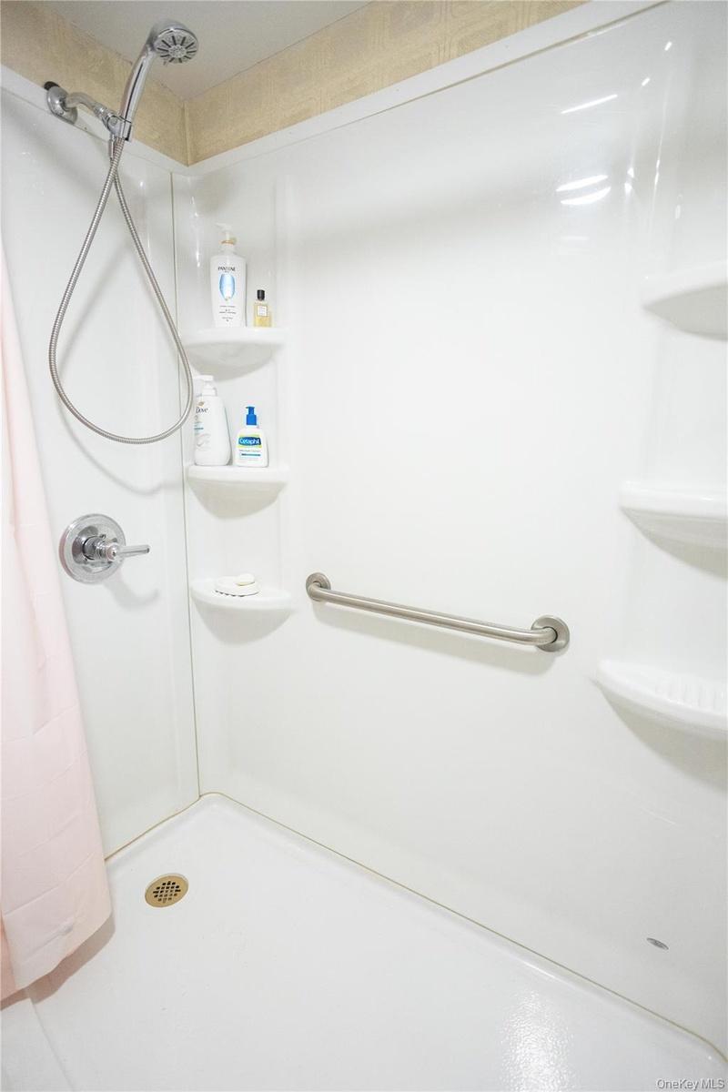 Bathroom with curtained shower