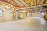 Below grade area featuring heating unit