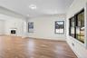 Unfurnished living room featuring a premium fireplace, light wood-style floors, crown molding, and recessed lighting