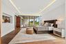 Primary suite with floor to ceiling windows.