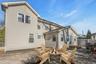 Rear view of property with a patio area and a fire pit