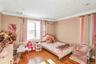 Bedroom featuring hardwood / wood-style floors and ornamental molding