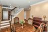 Dining space with wood finished floors, ornamental molding, stairs, and recessed lighting