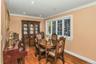 Dining space with light wood finished floors, ornamental molding, and recessed lighting