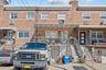 Traditional-style house with brick siding and stairway
