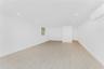 Spare room with a wall mounted AC, recessed lighting, and light wood finished floors