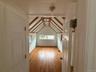 Bonus room featuring light wood-type flooring and baseboards