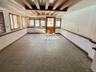 Empty room featuring beam ceiling and tile patterned flooring