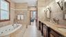 Attached to Primary Bedroom Tub and standing shower and double vanity