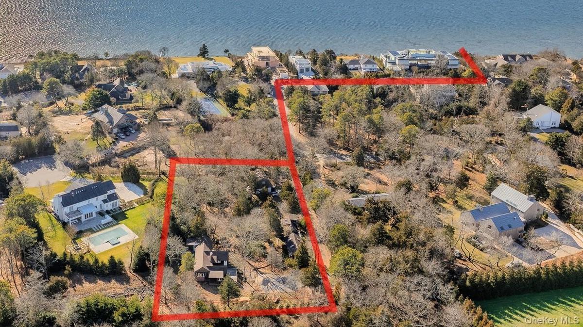 Aerial view of residential area featuring distance to the beach
