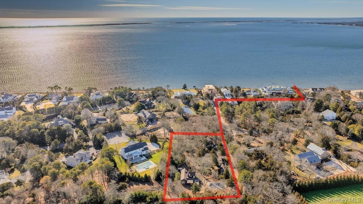 Aerial view of residential area featuring distance to the beach