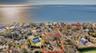Aerial view of residential area featuring distance to the beach