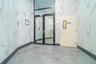 Unfurnished room with tile walls