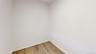 Unfurnished room featuring baseboards and wood finished floors