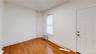 Spare room with radiator and hardwood / wood-style floors