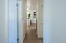 Corridor featuring wood finished floors
