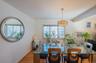 Dining room with plenty of natural light and light wood-style flooring