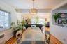 Dining area with a baseboard radiator and wood finished floors