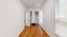 Corridor with baseboards and light wood finished floors