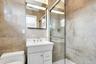 Master Full bath featuring tile walls, vanity, and tiled shower