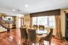 Dining space with hardwood / wood-style flooring and recessed lighting