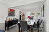 Dining area featuring crown molding, light wood-type flooring, and cooling unit