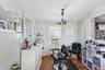 Office with a chandelier, dark wood-style flooring, ornamental molding, and plenty of natural light