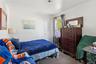 Bedroom featuring carpet flooring and crown molding