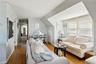 Living room featuring crown molding and wood finished floors