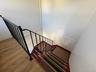 Staircase featuring wood finished floors