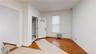 Foyer entrance with radiator and wood finished floors