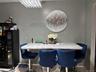 Dining area with a chandelier and baseboards