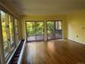 Doorway to outside with wood-type flooring and baseboards