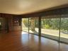 Entryway with wood finished floors, healthy amount of natural light, and wood walls