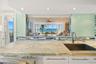 2 way mirror in the living room allows the views to carry through to the kitchen