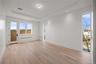 Primary bedroom showcasing floor to ceiling windows