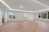 Oversized dining room/ living room featuring LED tray ceilings