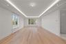 Oversized dining room/ living room featuring LED tray ceilings