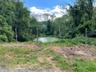 Street view to lot and pond