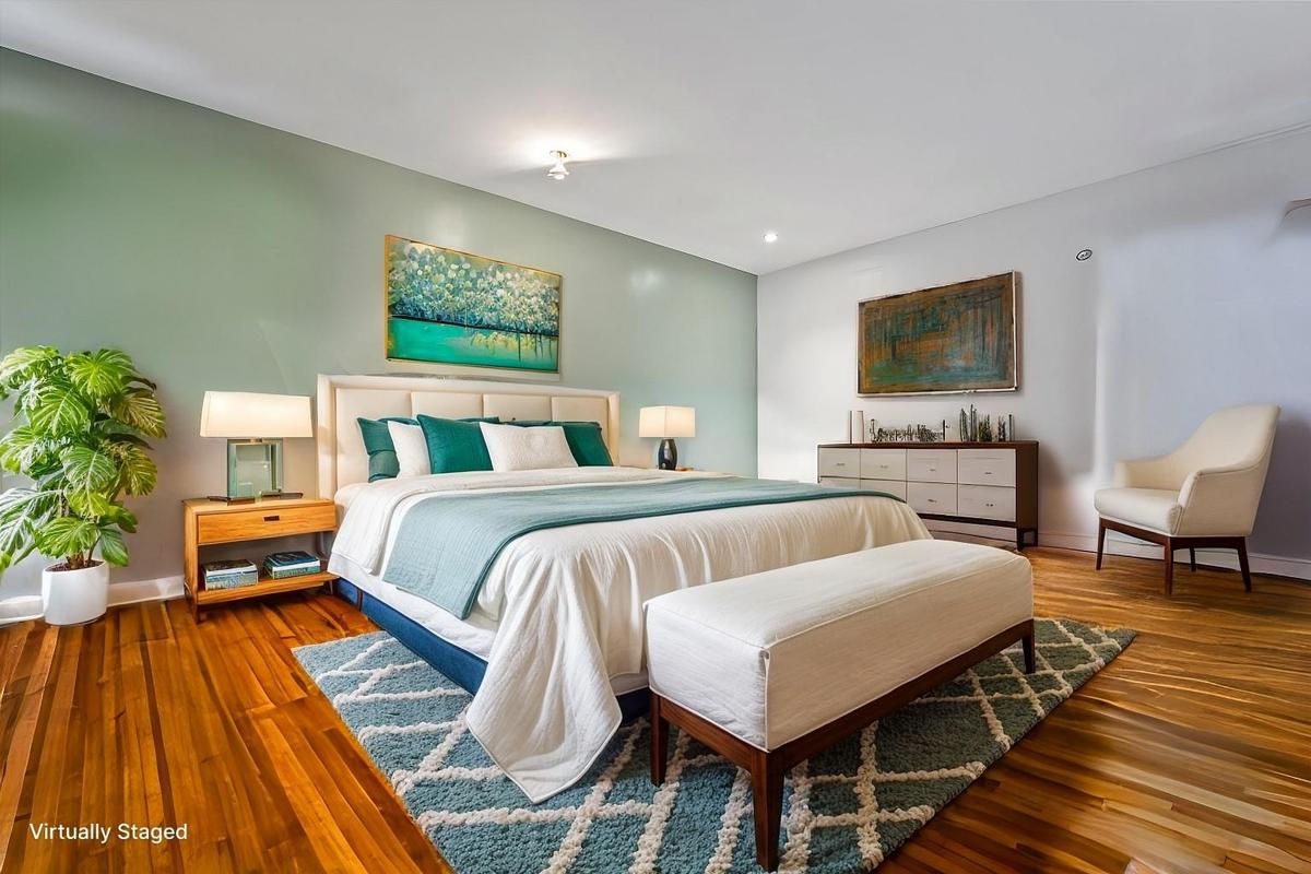 Bedroom with baseboards and hardwood / wood-style floors