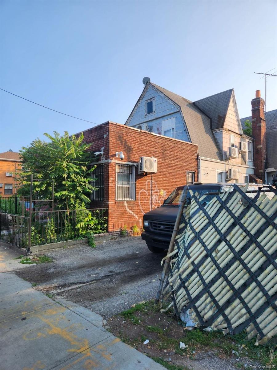 View of property exterior featuring brick siding