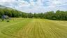 View of yard featuring a view of rural / pastoral area, a barn, and an outbuilding