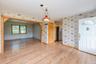Entrance foyer featuring wallpapered walls, baseboards, light wood-style floors, a baseboard radiator, and a baseboard heating unit